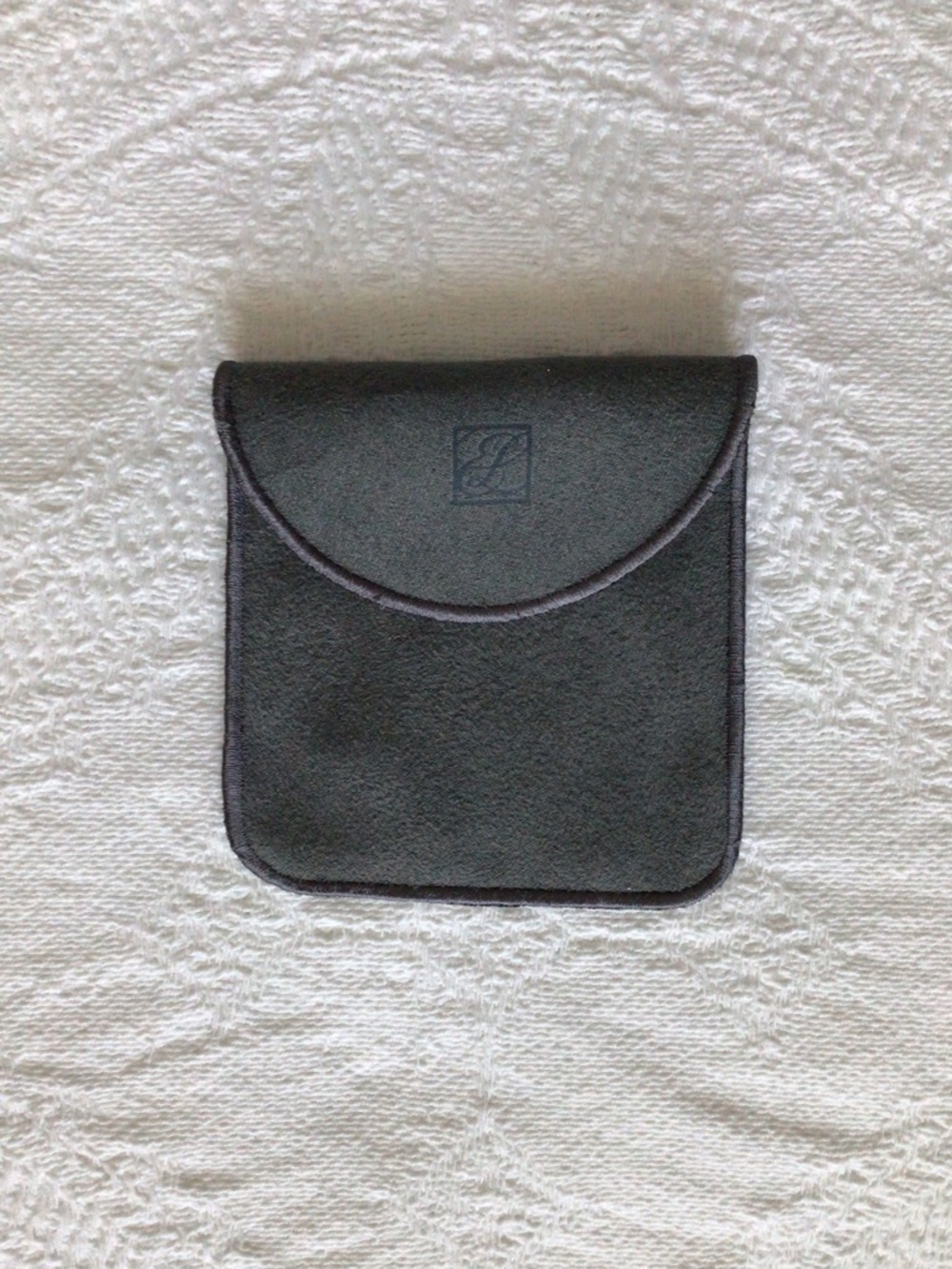 Estee Lauder gray pouch/cover